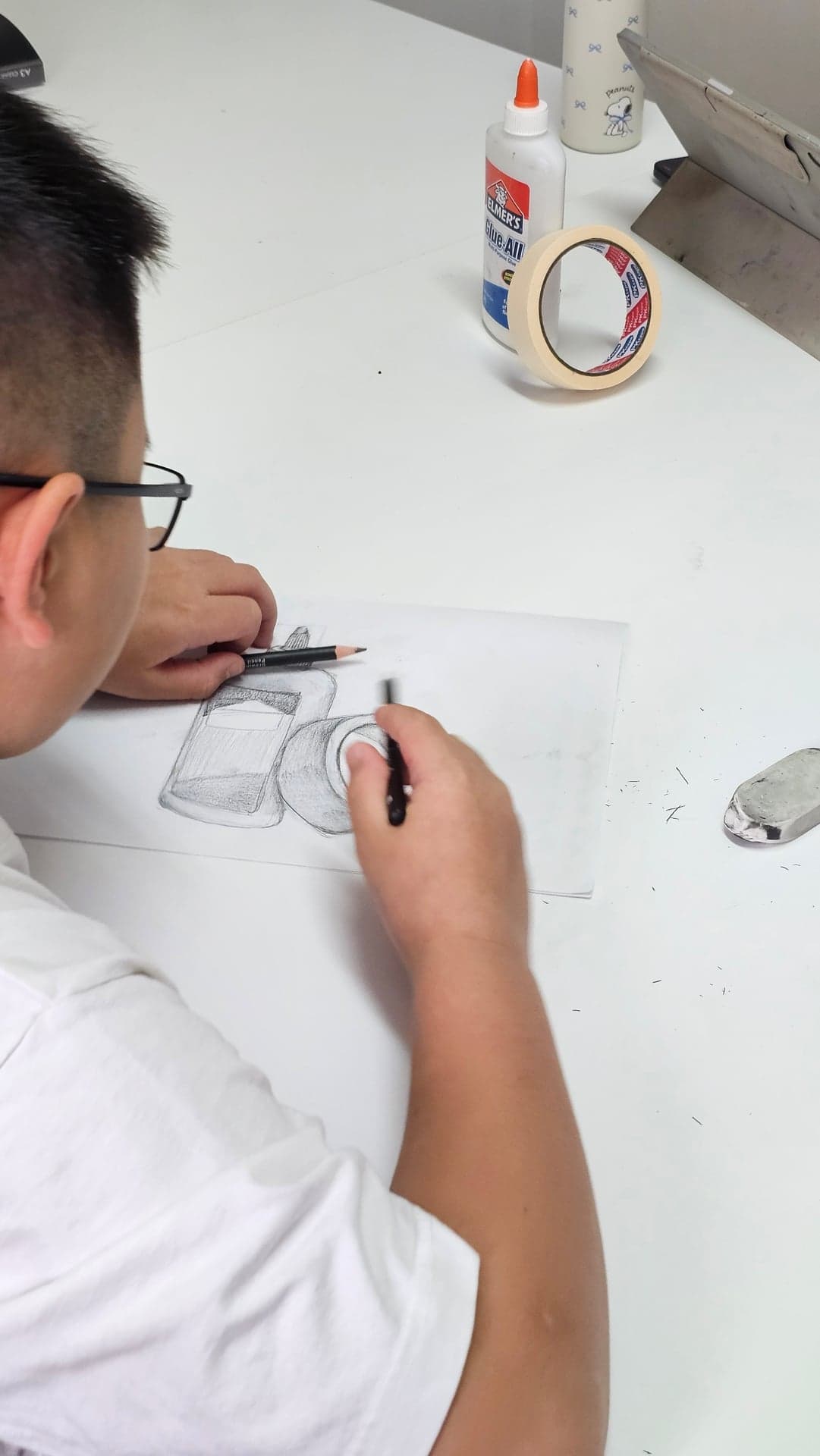 Student drawing a still-life in pencil during a focused one-to-one Art by Ancourage lesson