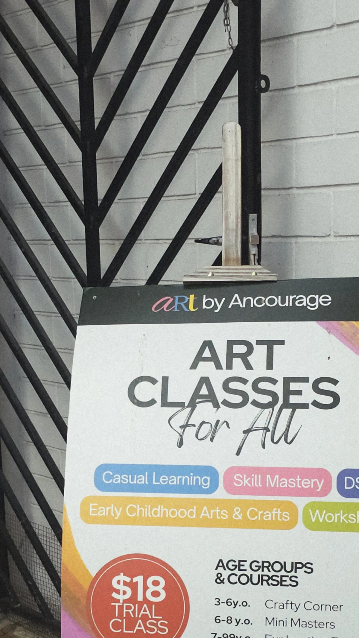 Art by Ancourage class guide at the Bishan centre listing age groups and courses from Crafty Corner to portfolio refinement, with trial classes from $18.