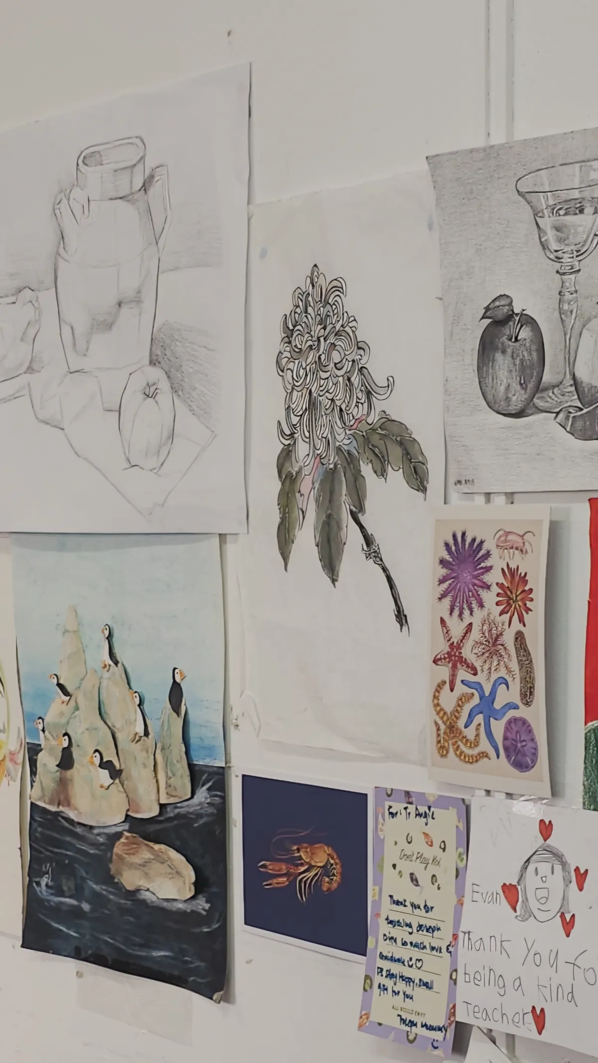 Student artwork and handwritten thank-you cards on the studio wall at Ancourage Academy Bishan.